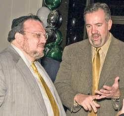 Joseph Shereshevsky (left) speaks to partner Steven Byers at an event in 2006.