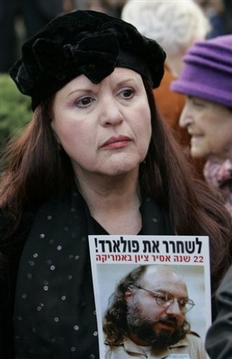 Esther Pollard, left, wife of imprisoned Jonathan Pollard, holds a picture of him during a protest in Jerusalem, demanding his release, Monday Jan. 7, 2008.
