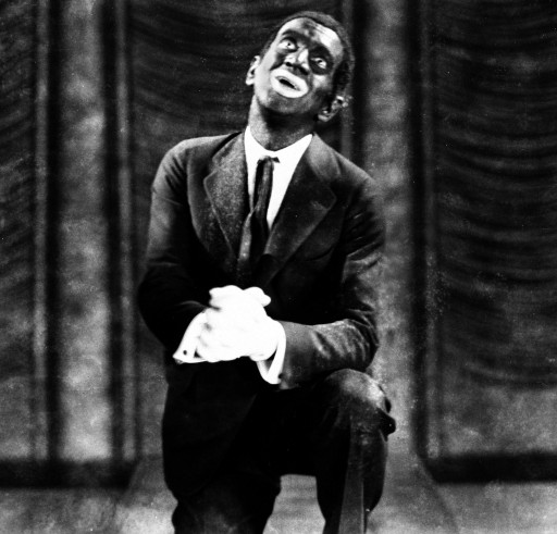 FILE - This 1927 image originally released by Warner Bros., shows Al Jolson in blackface makeup in the movie "The Jazz Singer." Historically, blackface emerged in the mid-19th century, representing a combination of put-down, fear and morbid fascination with black culture. Among the most prominent examples: Al Jolson and Eddie Cantor. Today, there’s a fine line between mockery and tribute. (AP Photo/Warner Bros.)