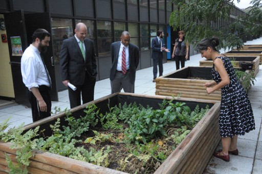 FILE - Headmaster Shimon Waronker, far left, with him (foreground, from left), at New American Academy school agricultural project, are  UFT President Michael Mulgrew, District Rep Rick King and teacher Lorraine Scorsone Sept. 22, 2011. (Miller Photography via UFT web site)