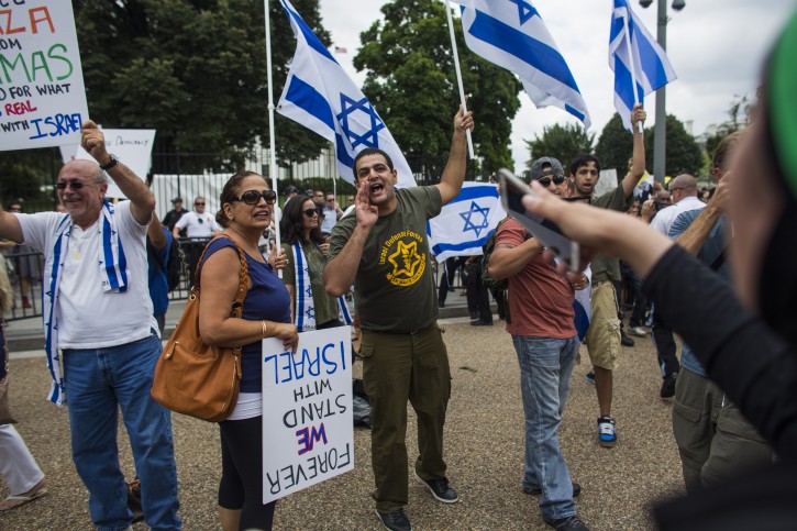  A small group of pro-Israel demonstrators shout at a much larger gathering of Arab American and anti-war groups who were protesting Israel's military offensive in Gaza, outside the White House in Washington, DC, USA, 02 August 2014. EPA