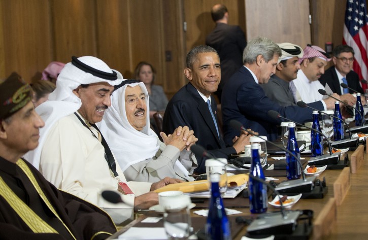 President Barack Obama sits with Kuwaiti Emir Sheikh Sabah Al-Ahmad Al-Sabah, Secretary of State John Kerry, center right, and Gulf Cooperation Council leaders and delegations at Camp David, Md., Thursday, May 14, 2015.(AP Photo/Pablo Martinez Monsivais)