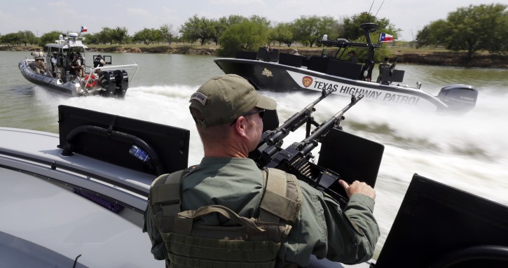 FILE - In this July 24, 2014 file photo, Texas Department of Safety Troopers patrol on the Rio Grand along the U.S.-Mexico border, in Mission, Texas. The states new Republican governor, Greg Abbott, this month approved $800 million for border security over the next two years,  more than double any similar period under 14 years of Perry, and by comparison, more than the state spends on environmental regulation. (AP Photo/Eric Gay, Pool, File)