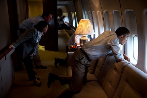 File photo of President Obama looking out the window of Air Force One. (Official White House Photo by Pete Souza)