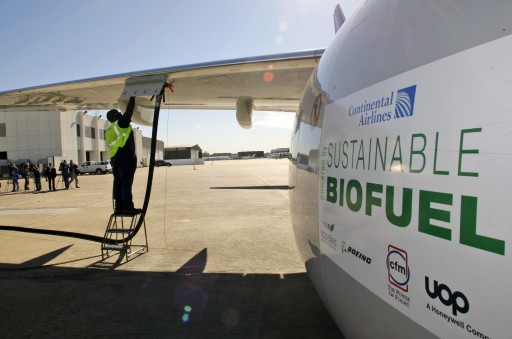 FILE - In this Jan. 7, 2009 file photo, Monte Hawkins prepares to remove the fuel line attached to a Continental Airlines jet for the first biofuel-powered demonstration flight of a U.S. commercial airliner, at Bush Intercontinental Airport in Houston. Many in the industry believe that without a replacement for jet fuel, growth in air travel could be threatened by forthcoming rules that limit global aircraft emissions. (AP Photo/David J. Phillip, File)
