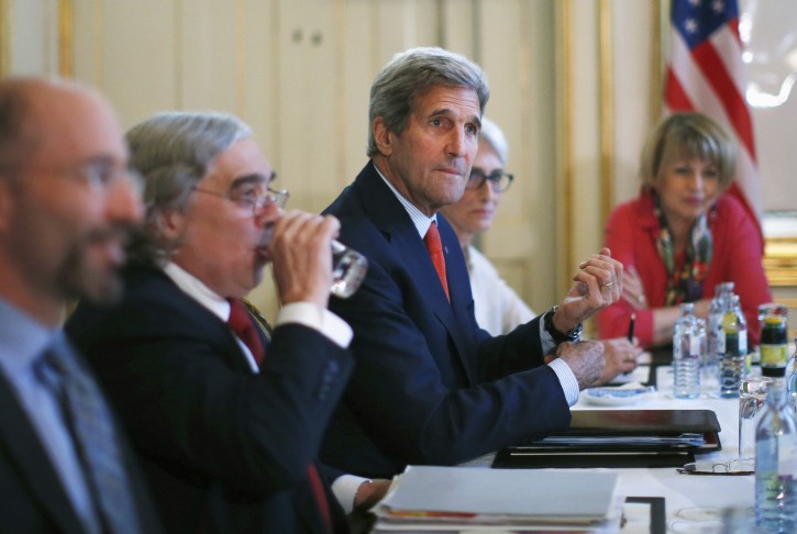 U.S. Secretary of State John Kerry, centre, meets with Iranian Foreign Minister Mohammad Javad Zarif in Vienna, Austria, Friday July 3, 2015.   AP