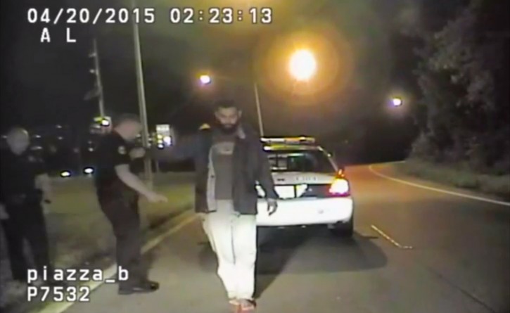 In this April 20, 2015 frame from dashcam video provided by the Chattanooga Police Department, Mohamad Youssef Abdulazeez undergoes roadside sobriety checks in Chattanooga, Tenn. On July 16, Abdulazeez opened fire on a recruiting office and then headed across town and blasted his way through a Navy-Marine reserve center. (Chattanooga Police Department via AP)