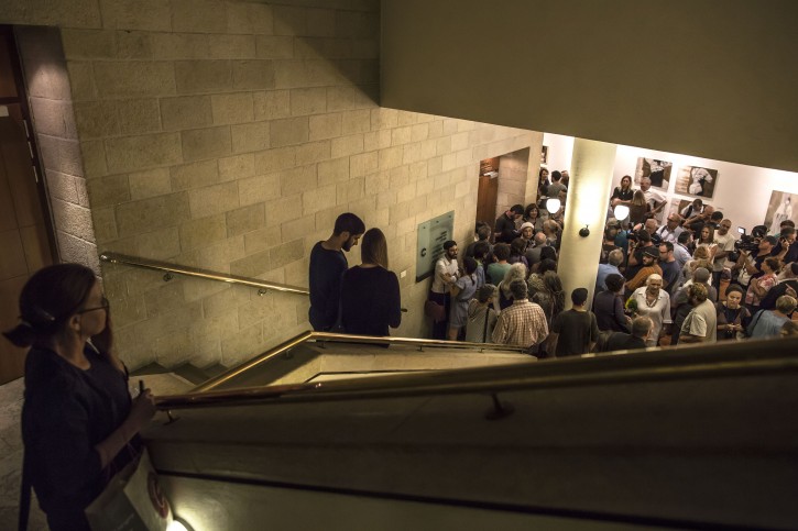 In this photo taken Wednesday, July 8, 2015, Israelis wait for a screening of Beyond the Fear movie in Jerusalem. A new documentary has set off an uproar in Israel for its peek into the family life of the countrys most reviled prisoner, the man who assassinated Prime Minister Yitzhak Rabin nearly 20 years ago.(AP Photo/Tsafrir Abayov)