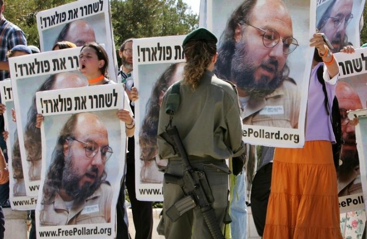 FILE - Israeli protesters hold posters of Jonathan Pollard in front of Israeli Prime Minister's office in Jerusalem.  Reuters