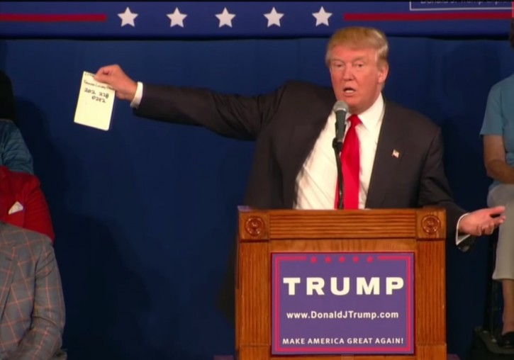 trump FILE - Republican presidential hopeful Donald Trump holds up a sheet of paper as he talks about calling Republican presidential candidate, Sen. Lindsey Graham, R-S.C., during his South Carolina campaign kickoff rally in Bluffton, S.C., Tuesday, July 21, 2015.