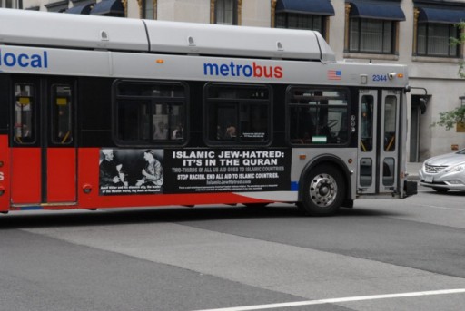 A Metro bus, featuring a controversial ad, drives on a street in Washington, DC on May 21, 2014.(Atlas Media) 