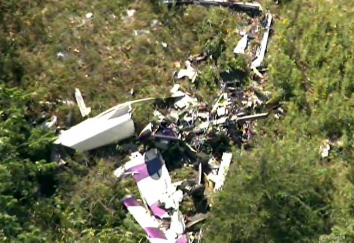 This image taken from video and provided by WABC/abc7NY.com, shows the wreckage of a stunt plane from the air of WABC TVs NewsCopter7 as it flies near Stuart Air Force Base in New Windsor, N.Y., Friday, Aug. 28, 2015. A pilot was killed after his propeller-driven stunt plane crashed while he was practicing tricks for a weekend air show in New York's Hudson Valley, state police said Friday. (WABC/abc7NY.com via AP)