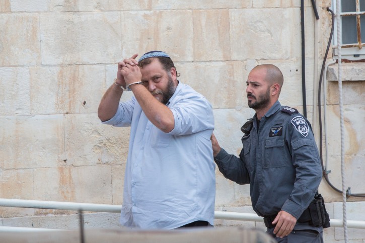 FILE - Lehava chairman Benzi Gopstein are brought to the Jerusalem's Magistrates Court in Jerusalem on December 16, 2014. Flash90