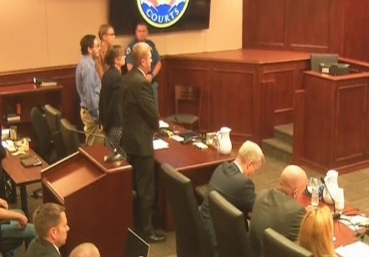 FILE  -James Holmes (L) stands in court as the verdict is read in this still image taken from video in Denver, Colorado, July 16, 2015. Reuters