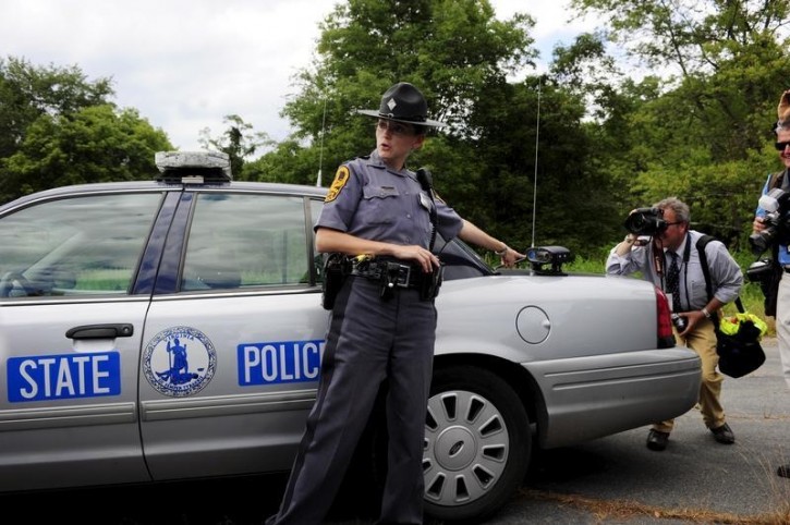 Virginia State Police Trooper Pamela Neff (L) addresses reporters about her traffic stop of Vester L. Flanagan, also known as Bryce Williams, off Highway I-66 in Fauquier County, Virginia August 26, 2015. REUTERS