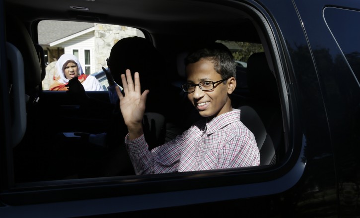 Ahmed Mohamed, 14, waves before leaving his family's home in Irving, Texas, Thursday, Sept. 17, 2015. Ahmed was arrested Monday at his school after a teacher thought a homemade clock he built was a bomb. He remains suspended and said he will not return to classes at MacArthur High School. (AP Photo/LM Otero)