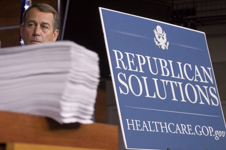 FILE - In this Oct. 29, 2009 file photo then-House Minority Leader John Boehner of Ohio stands behind a copy of the Democrat's version of the health care bill during a news conference on Capitol Hill in Washington. Boehners announced exit as House speaker and from Congress altogether caps a political career that began as the head of a homeowners association in an Ohio neighborhood and made him second in line to the presidency.  (AP Photo/Harry Hamburg, File)