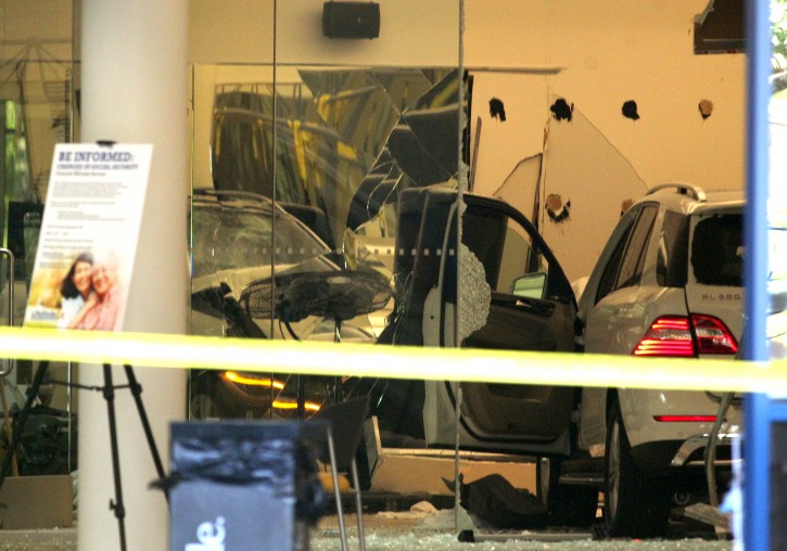 A vehicle sits inside a health club after a motorist crashed through the doors, in Livermore, Calif., on Tuesday, Sept. 22, 2015. An 80-year-old driver accidentally hit the gas pedal instead of the brake Tuesday before plowing through the doors of a Northern California health club, killing one person and injuring five others, police said.    (Anda Chu/Bay Area News Group via AP)