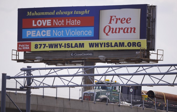 In this Monday, Aug. 31, 2015 photo a billboard proclaims the teachings of Islam near the Massachusetts Avenue Exit of I-93 north in Boston. Dozens of billboards with Muslim themes are sprouting nationwide, proclaiming what organizers say is the true message of Islam and its prophet, Muhammad: peace and justice, not extremism and violent jihad. (AP Photo/Stephan Savoia)