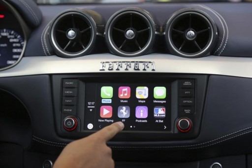 FILE - Apple's Stephen Chick displays the CarPlay program at the Worldwide Developers Conference in San Francisco, California June 2, 2014. REUTERS/Robert Galbraith  