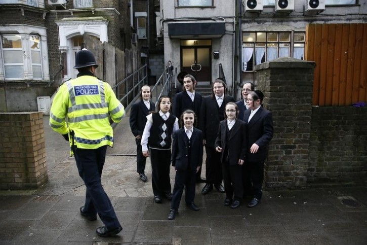 FILE - A police officer patrols in a Jewish neighbourhood in north London, January 17, 2015. REUTERS/Stefan Wermuth
