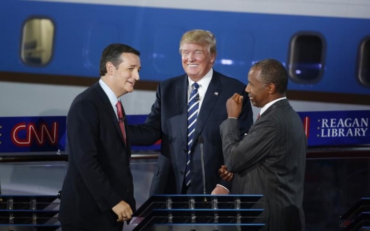 FILE - Republican U.S. presidential candidates (L-R) U.S. Senator Ted Cruz, businessman Donald Trump and Dr. Ben Carson talk during a commercial break in the midst of the second official Republican presidential candidates debate of the 2016 U.S. presidential campaign at the Ronald Reagan Presidential Library in Simi Valley, California, United States, September 16, 2015. REUTERS/Lucy Nicholson