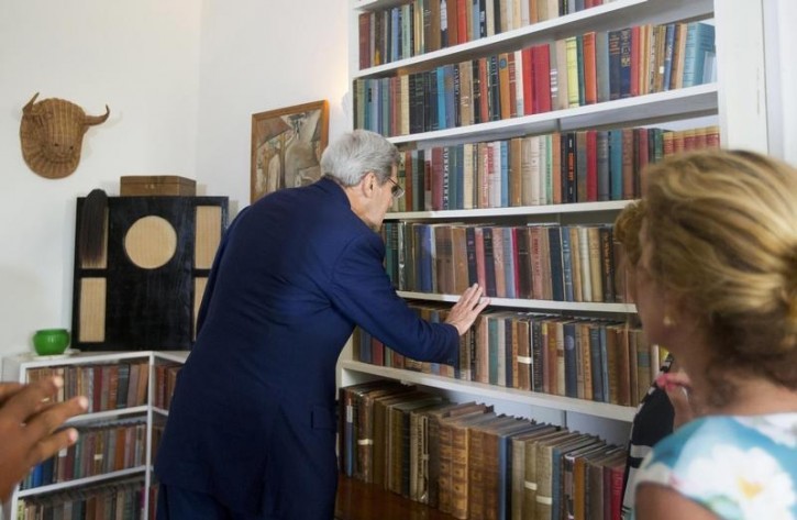 FILE - U.S. Secretary of State John Kerry looks over book collection on the shelves during his visit to Finca Vigia  (Lookout Farm), Hemingway's home, and now houses a museum in Havana, Cuba, August 14, 2015. Reuters