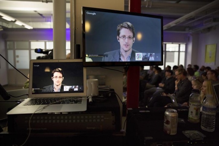 American whistleblower Edward Snowden is seen on monitors as he delivers remarks via video link from Moscow to attendees at a discussion regarding an International Treaty on the Right to Privacy, Protection Against Improper Surveillance and Protection of Whistleblowers in Manhattan, New York September 24, 2015. REUTERS