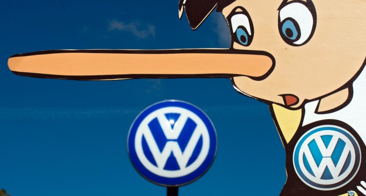 A sign featuring the fictional character Pinocchio, known for having a short nose that grows longer when lying, and a Volkswagen logo, held by activists of environmental organization Greenpeace during a rally in front of the Volkswagen (VW) plant inÂ Wolfsburg, Germany, 25 September 2015.  EPA/JULIAN STRATENSCHULTE