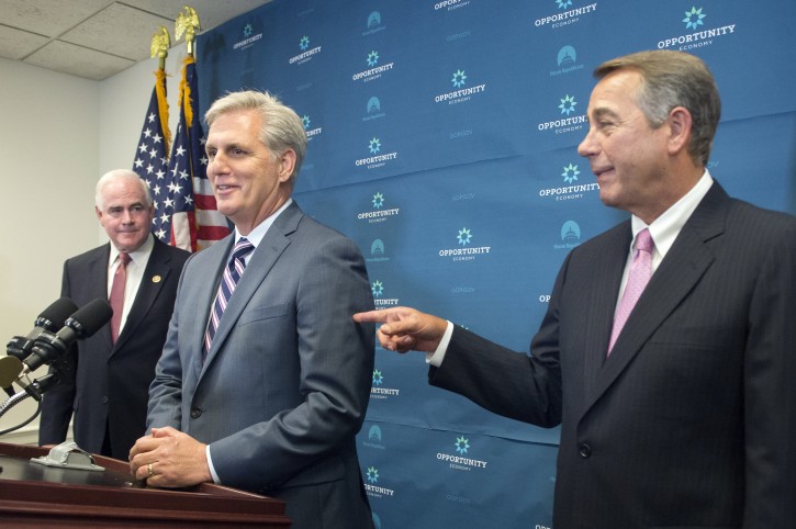 US Speaker of the House Republican John Boehner (R) points at House Majority Leader Republican Kevin McCarthy (C), as Republican Representative from Pennsylvania Patrick Meehan (L) looks on during a news conference after a meeting of the House Republican conference, on Capitol Hill in Washington, DC, USA, 29 September 2015. B