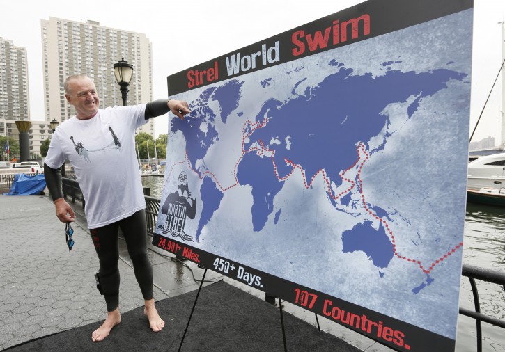 Martin Strel illustrates the route for his planned "Strel World Swim" at Brookfield Property Partners' site at North Cove Marina in Downtown Manhattan on Thursday, Sept. 10, 2015, in New York, N.Y. On March 22nd, 2016, World Water Day, Strel will commence his "Strel World Swim" through 107 countries in approximately 450 days as a means of spreading clean water awareness. (Photo by Stuart Ramson/Invision for Martin Strel/AP Images)