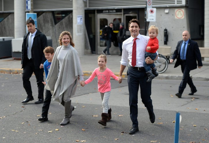Liberal leader Justin Trudeau, second right, and family arrive to vote at a polling station in Montreal on Monday, Oct. 19, 2015. Canadians voted Monday to decide whether to extend Conservative Prime Minister Stephen Harper's near-decade in power or return Canada to its more liberal roots. (Sean Kilpatrick/The Canadian Press via AP) 