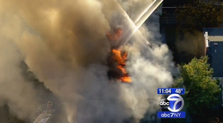 In this frame from video provided by WABC-TV, smoke and flames rise Friday, Oct. 23, 2015, at the Poile Zedek, a synagogue in New Brunswick, N.J. According to the congregation's website, the building was placed on the National Register of Historic Places in 1995. (WABC-TV via AP) 