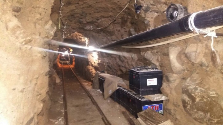 This Wednesday, Oct. 21, 2015 photo released by Mexico's Federal Police shows an underground tunnel that police say was built to smuggle drugs from Tijuana, Mexico to San Diego in the United States. Mexican federal police said the tunnel extends about 2,600 feet (800 meters) and is lit, ventilated, equipped with a rail car system, and lined with metal beams to prevent collapse. (Mexico Federal Police via AP)