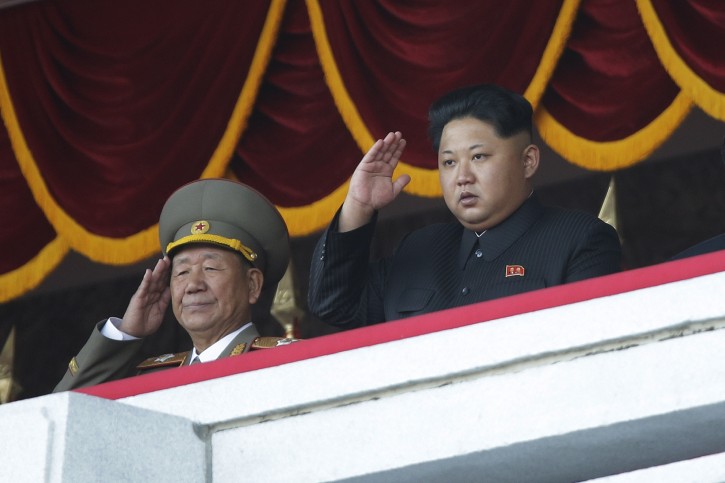 North Korean leader Kim Jong Un, right, salutes at a parade in Pyongyang, North Korea, Saturday, Oct. 10, 2015. North Korean leader Kim Jong Un declared Saturday that his country was ready to stand up to any threat posed by the United States as he spoke at a lavish military parade to mark the 70th anniversary of the North's ruling party and trumpet his third-generation leadership. (AP Photo/Wong Maye-E)