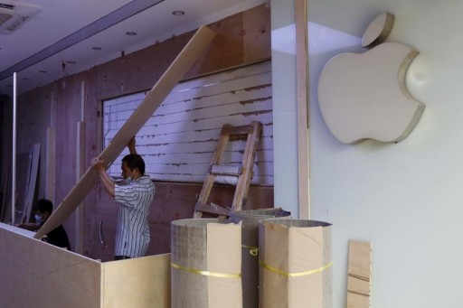FILE - An Apple logo is seen in a store, which is being decorated before its opening, in Shenzhen, China September 21, 2015.REUTERS