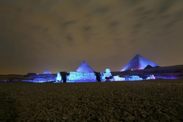 The Great Pyramids and Sphinx reflect blue light during a celebration for the 70th anniversary of the United Nations in Giza, Egypt, October 24, 2015. REUTERS/Mohamed Abd El Ghany