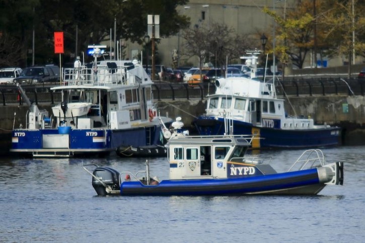 New York City Police (NYPD) boats are seen on the Harlem river in the East Harlem neighborhood of Manhattan, in New York City  October 25, 2015. REUTERS
