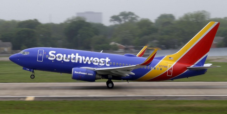 FILE- In this April 23, 2015, file photo, a Southwest airlines jet takes off from a runway at Love Field in Dallas. Southwest Airlines is asking travelers on Sunday, Oct. 11, to arrive at least two hours before their scheduled departures as technical issues are forcing it to check-in some customers manually. (AP Photo/LM Otero, File)