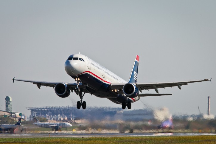 US Airways flight 1939, the final US Airways flight, departs Philadelphia International Airport en route to Charlotte, N.C. on Friday, Oct. 16, 2015. All future flights will fly under the American Airlines banner, following the completion of a merger announced in 2013. (Alejandro A. Alvarez/The Philadelphia Inquirer via AP) 