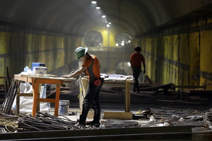 Contractors work on the East Side Access project beneath midtown Manhattan, Wednesday, Nov. 4, 2015, in New York. When completed, the East Side Access will allow the MTA's Long Island Rail Road passengers to get off on Manhattan's East Side at Grand Central Terminal from Long Island through a Queens station linked to the 120-foot tunnel. The target completion date is 2022. (AP Photo/Mary Altaffer)