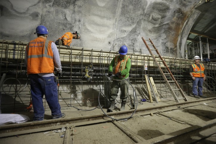 Contractors work on the East Side Access project beneath midtown Manhattan, Wednesday, Nov. 4, 2015, in New York.  When completed, the East Side Access will allow the MTA's Long Island Rail Road passengers to get off on Manhattan's East Side at Grand Central Terminal from Long Island through a Queens station linked to the 120-foot tunnel. The target completion date is 2022. (AP Photo/Mary Altaffer)