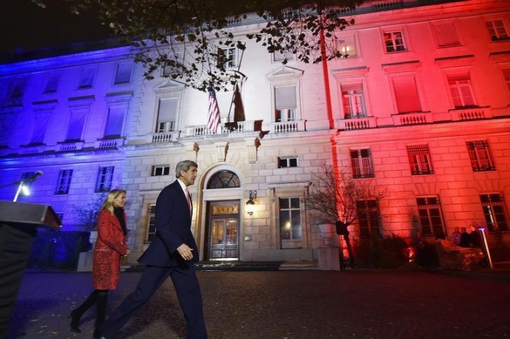 FILE - US Secretary of State John Kerry (C), next to US ambassador to France Jane D. Hartley, leaves after delivering a speech at the US embassy illuminated with the colors of the French national flag on November 16, 2015 in Paris. REUTERS/Dominique Faget/Pool