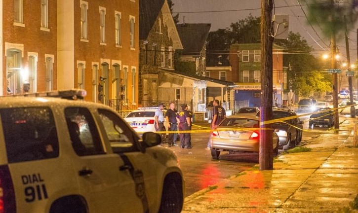 FILE - Police investigate the scene of a shooting along Ogden Street in Philadelphia, United States, June 20, 2015.  Reuters