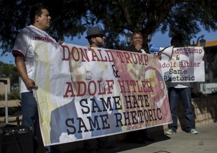 Activists rally to protest against U.S. Republican presidential candidate Donald Trump hosting the upcoming episode of the television show "Saturday Night Live" in Universal City, California November 6, 2015.  REUTERS/Mario Anzuoni -
