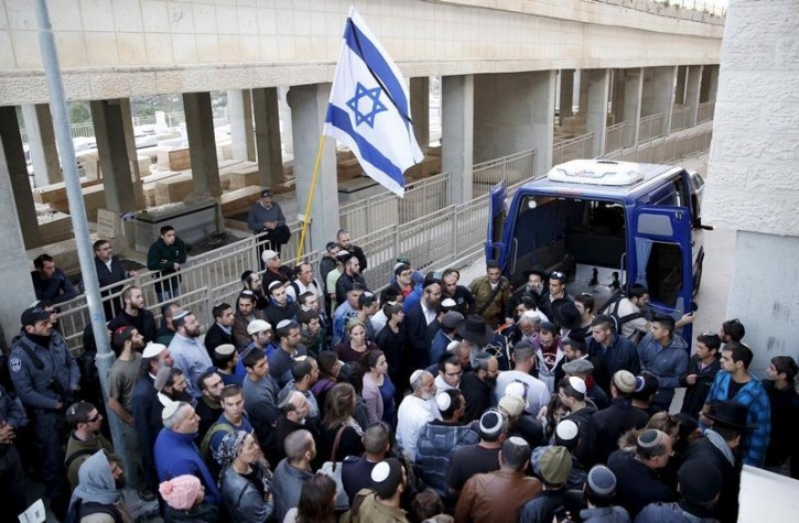 The covered body of Israeli woman Hadar Buchris is carried to burial during her funeral in Jerusalem The covered body of Israeli woman Hadar Buchris, 21, is carried to burial during her funeral in Jerusalem, November 23, 2015. Reuters