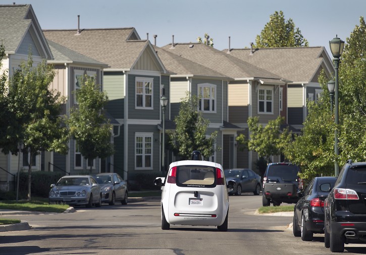 Google's self-driving car tours the Mueller Housing Development, Wednesday, Sept. 23, 2015, in Austin, Texas. Hustling to bring cars that drive themselves to a road near you, Google finds itself somewhere that has frustrated many before: Waiting for help from California's department of motor vehicles. (Ralph Barrera/Austin American-Statesman via AP)  
