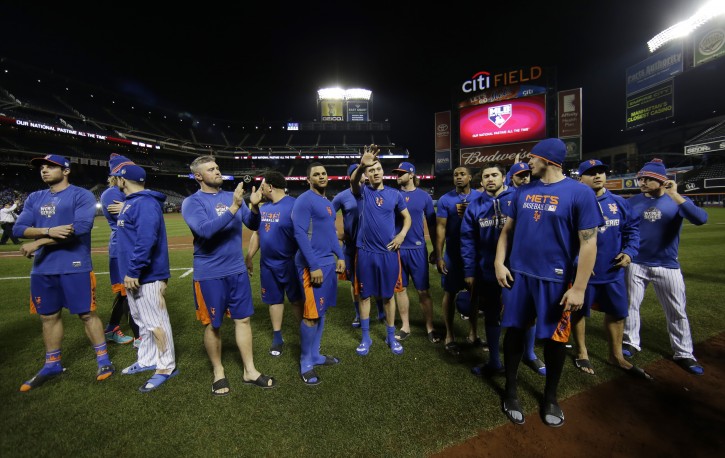 New York Mets applaud their fans after Game 5 of the Major League Baseball World Series against the Kansas City Royals Monday, Nov. 2, 2015, in New York. The Royals won 7-2 to win the series. (AP Photo/Matt Slocum)