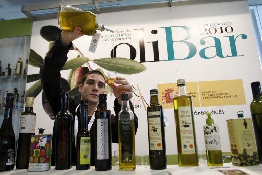 FILE - A file picture dated 26 January 2011 shows a man preparing an olive oil tasting at the OliBar during the 2011 Madrid Fusion Summit in Madrid, Spain. EPA