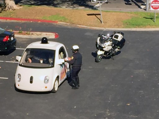 A Mountain View police officer pulled over one of Google's self-driving cars on El Camino Real, near Rengstorff Avenue, on Thursday. ( Photo courtesy Zandr Milewski )